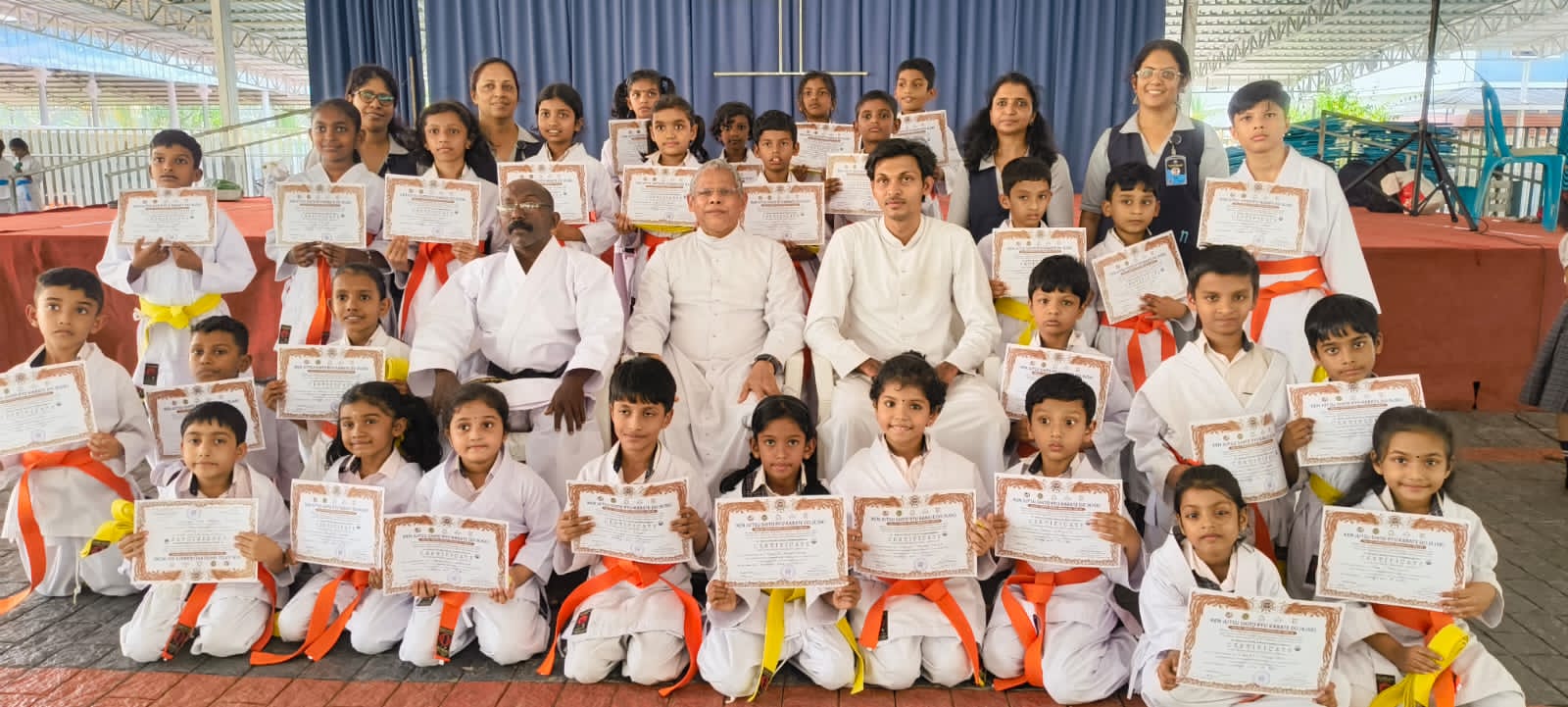 Karate students with certificates